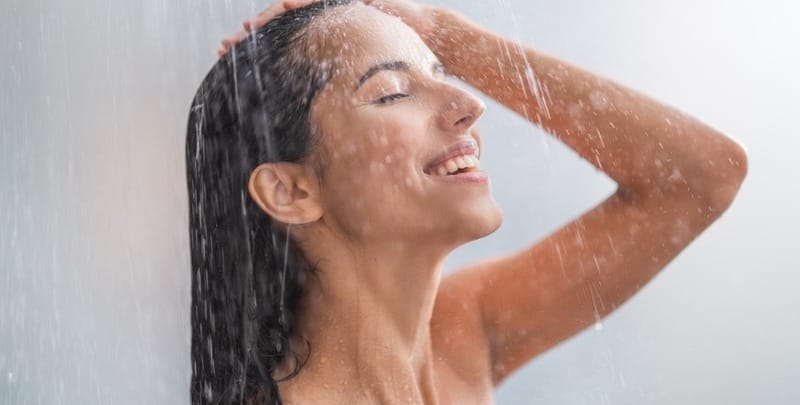 Woman enjoys a hot shower